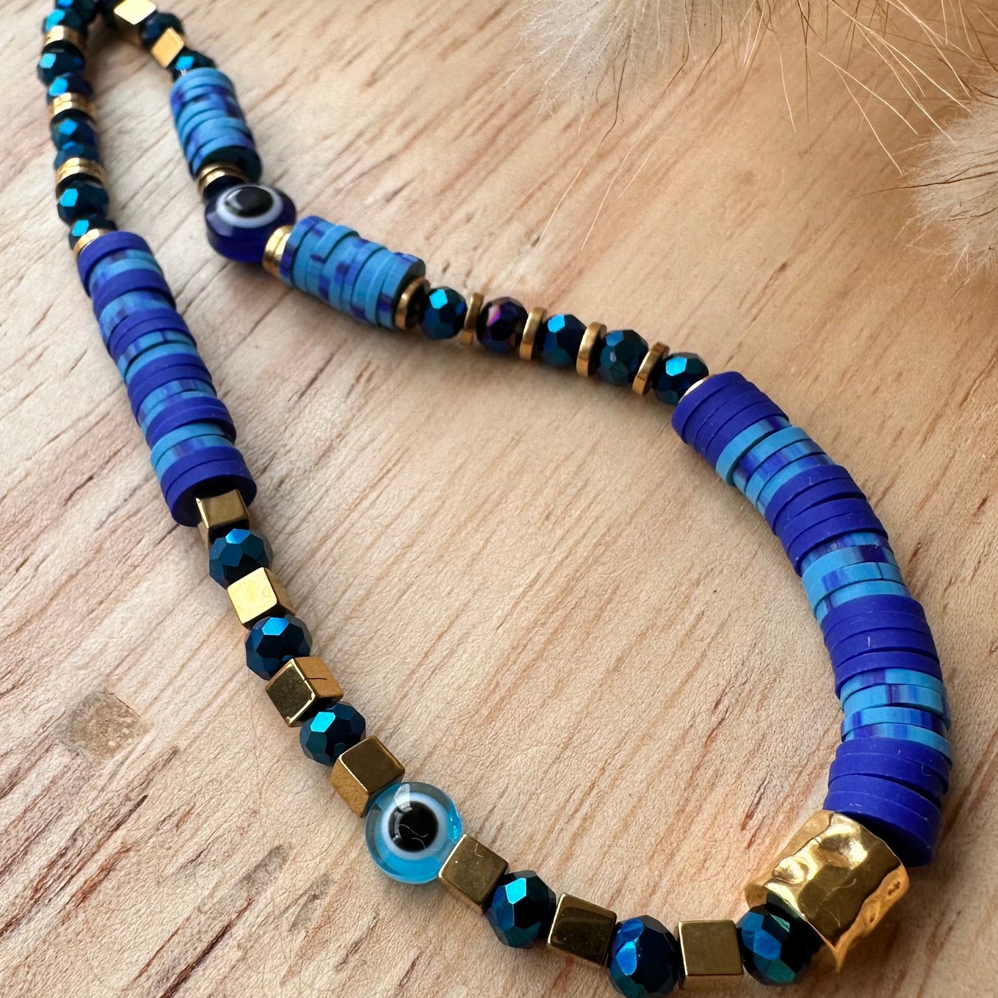 Grigri de téléphone cristal et oeil