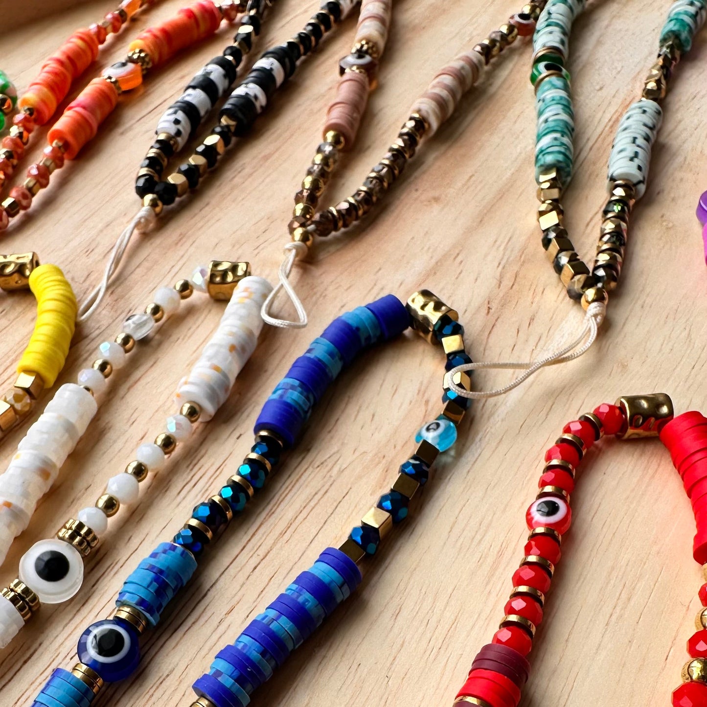 Grigri de téléphone cristal et oeil