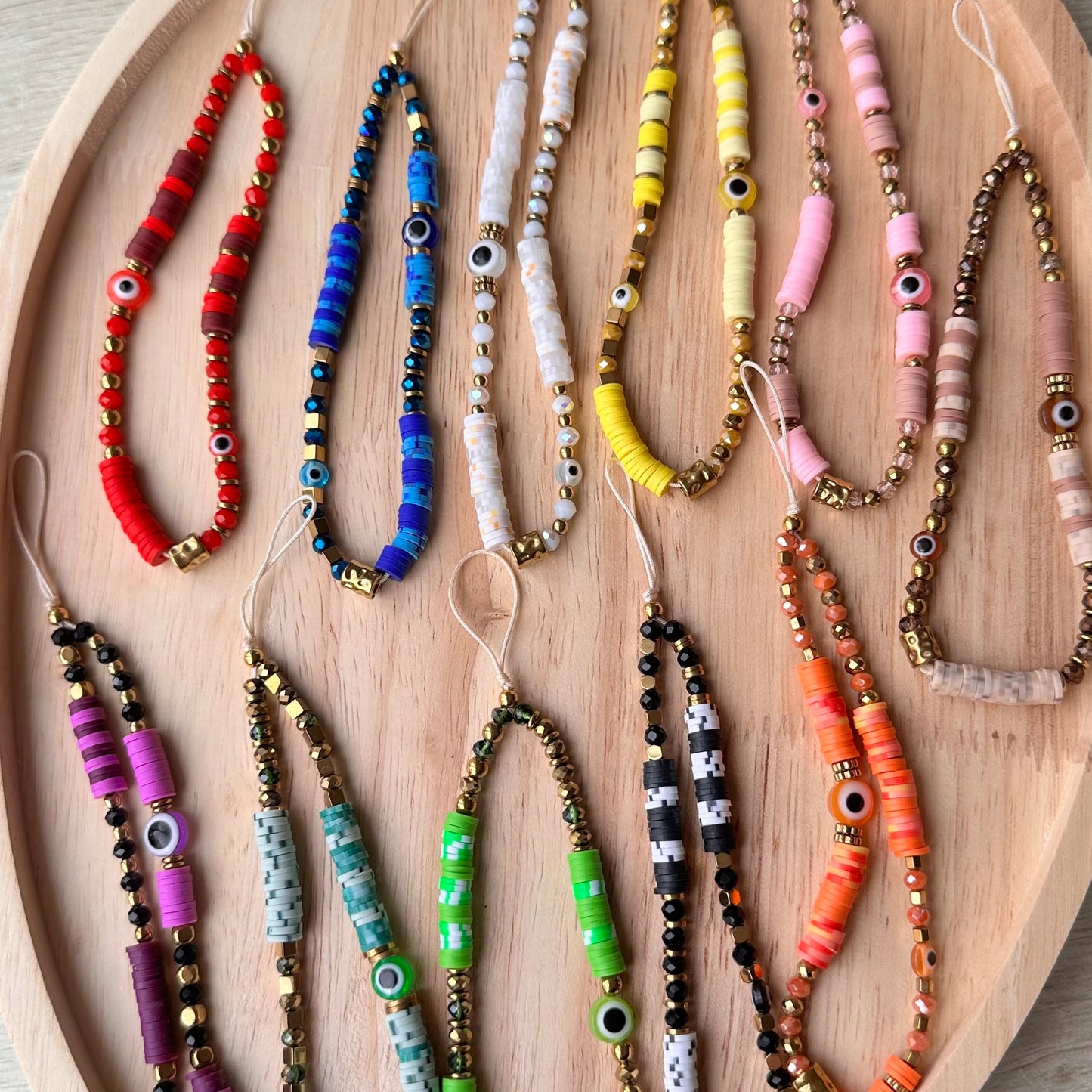 Grigri de téléphone cristal et oeil